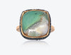 aquaprase ring set in rose gold with black diamonds